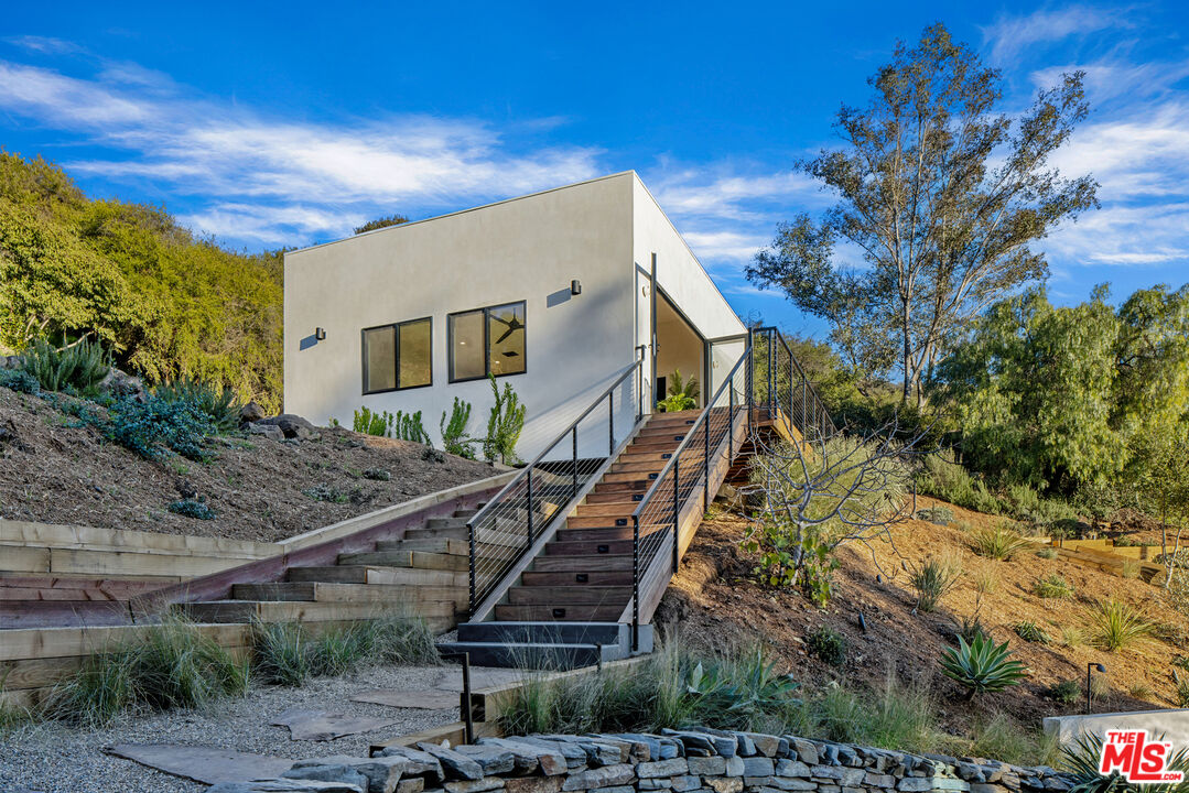 20711 Hillside Drive Topanga, CA 90290 - Photo 25 of 41 a front view of a house with a tree