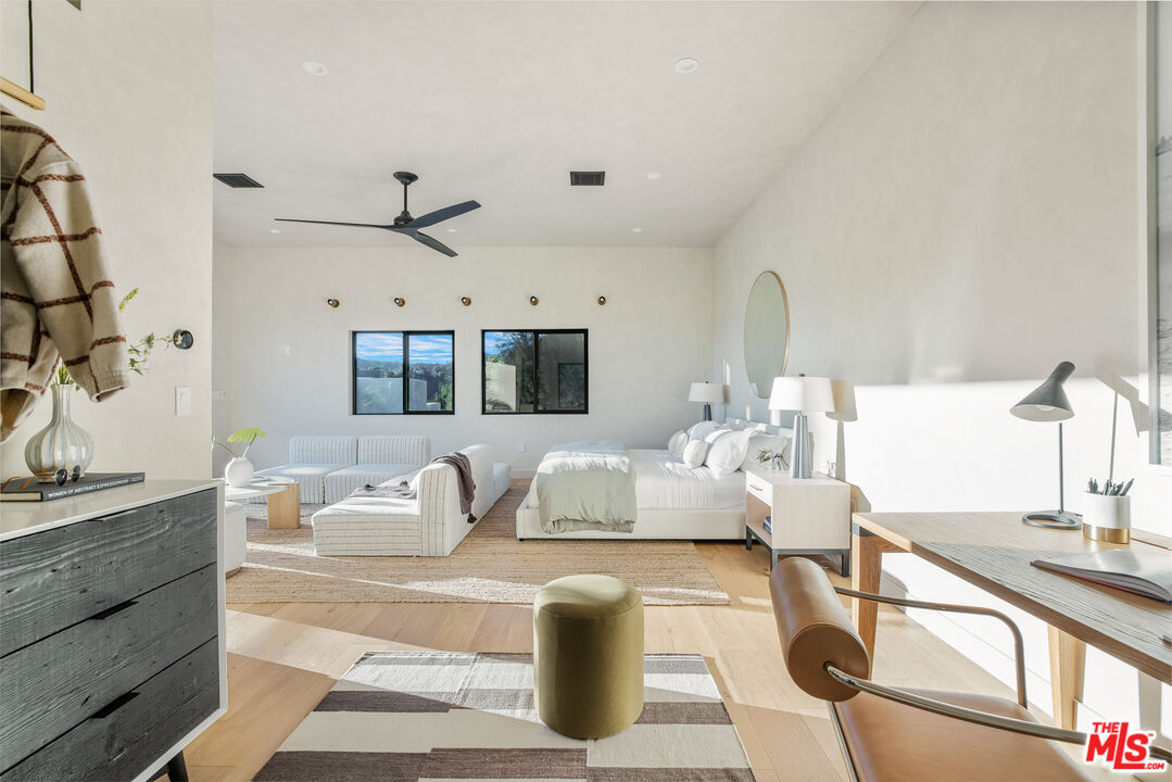 20711 Hillside Drive Topanga, CA 90290 - Photo 27 of 41 a living room with furniture and a large mirror