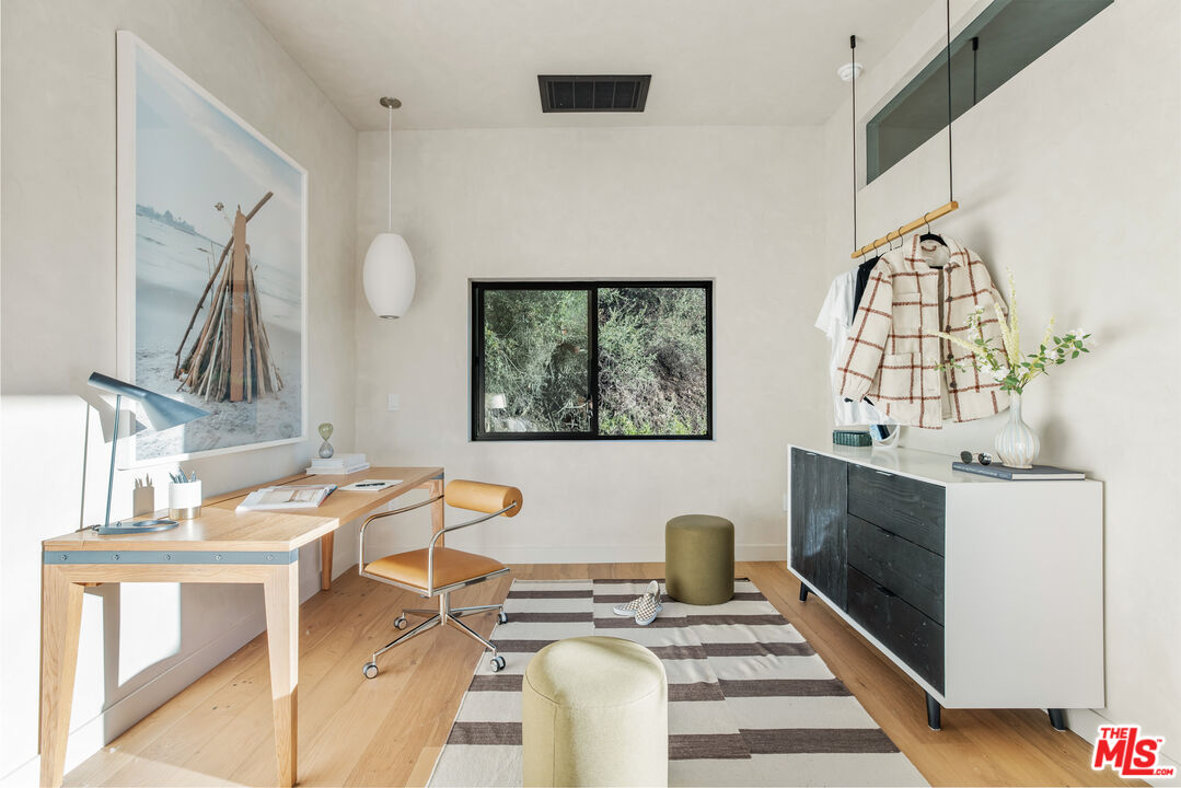 20711 Hillside Drive Topanga, CA 90290 - Photo 28 of 41 a living room with furniture a fireplace and a flat screen tv