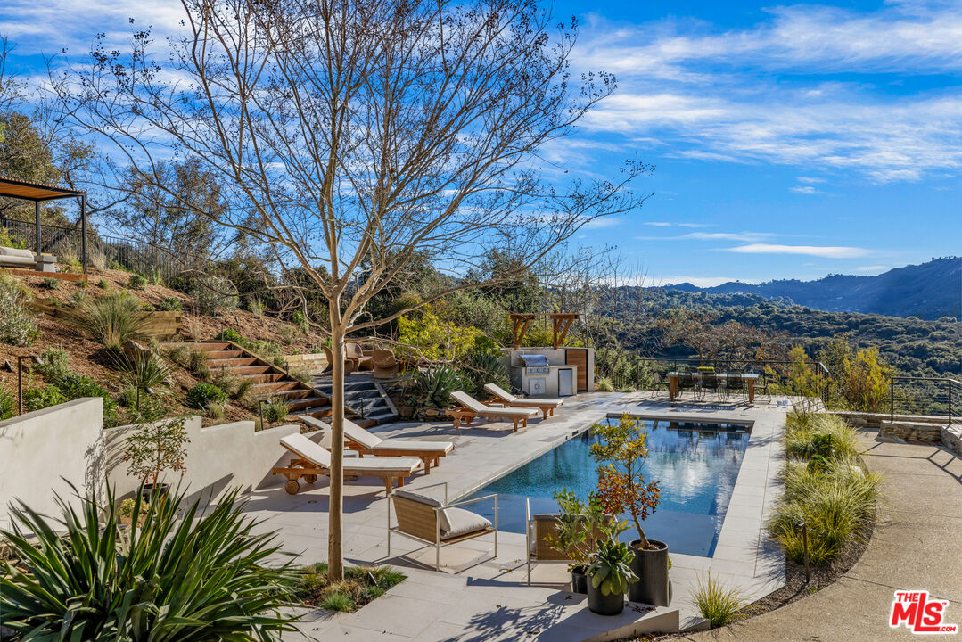 20711 Hillside Drive Topanga, CA 90290 - Photo 3 of 41 a view of a houses with a yard