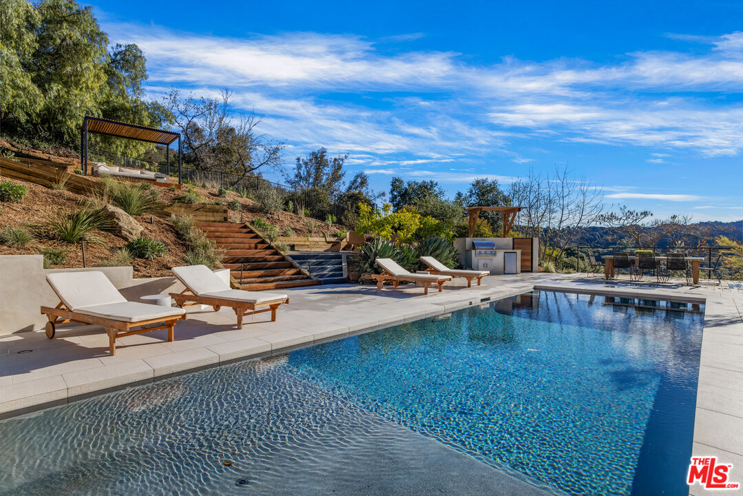20711 Hillside Drive Topanga, CA 90290 - Photo 4 of 41 a view of a swimming pool with lounge chair