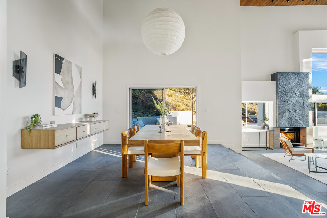 20711 Hillside Drive Topanga, CA 90290 - Photo 8 of 41 a dining room with furniture and wooden floor