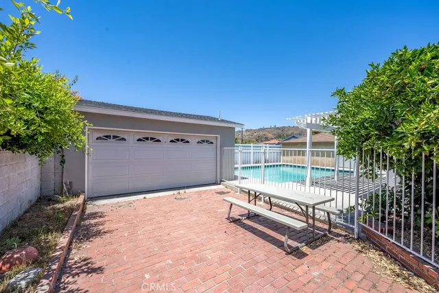 a blue bench sitting in front of a building