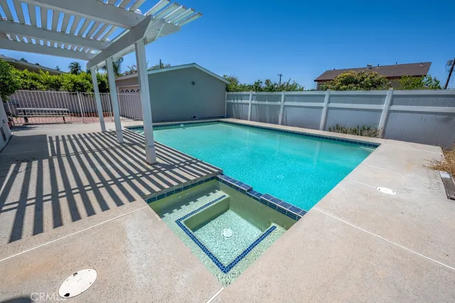 a view of a backyard with sitting area