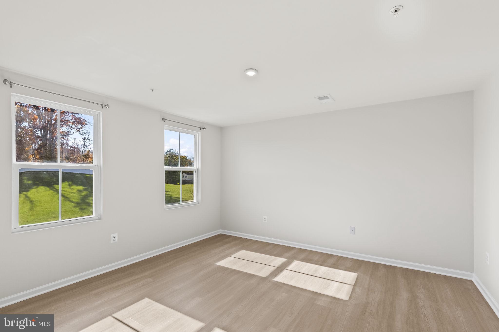 5404 Vergo Road Capitol Heights, MD 20743 - Photo 11 of 36 an empty room with windows