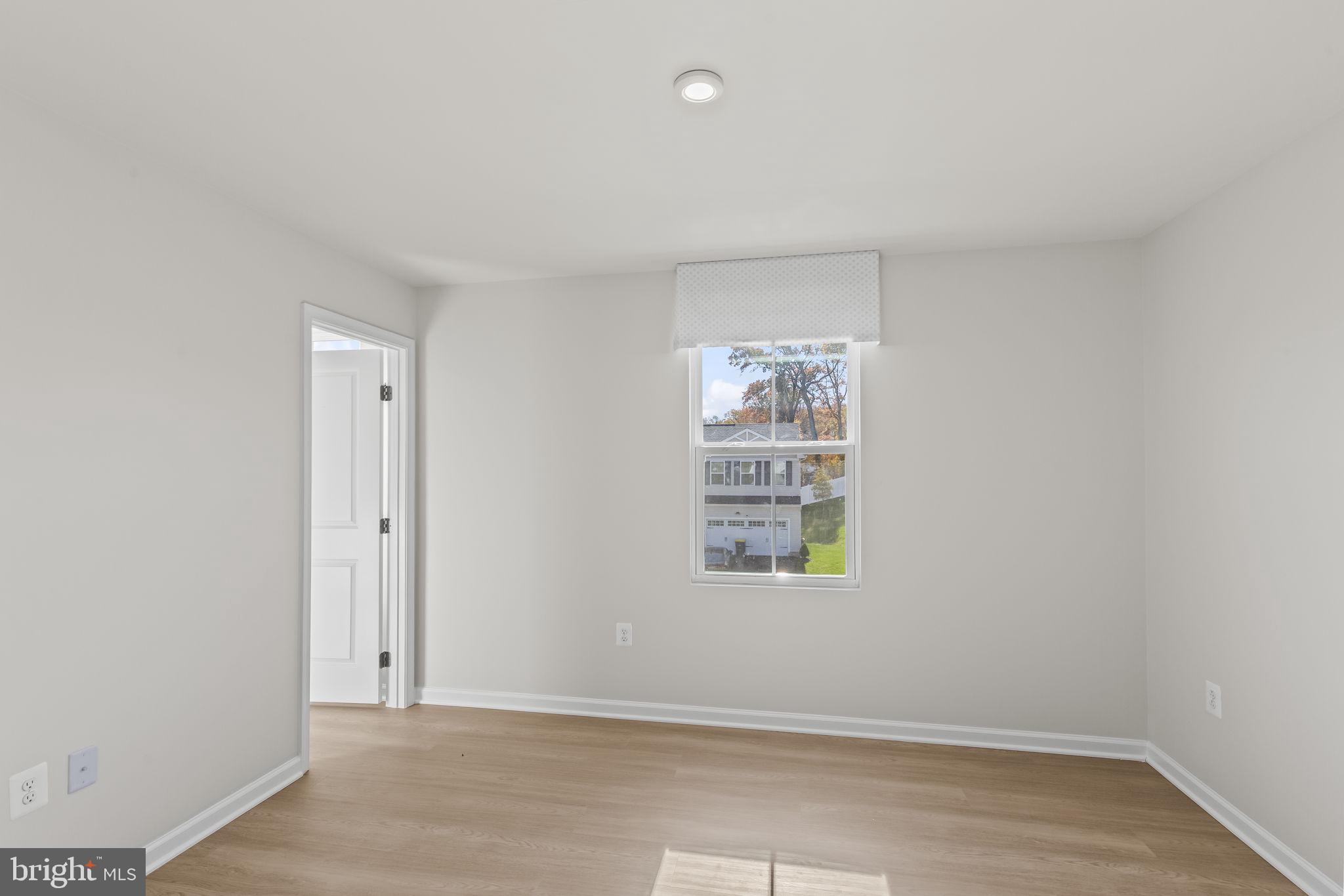 5404 Vergo Road Capitol Heights, MD 20743 - Photo 16 of 36 an empty room with windows