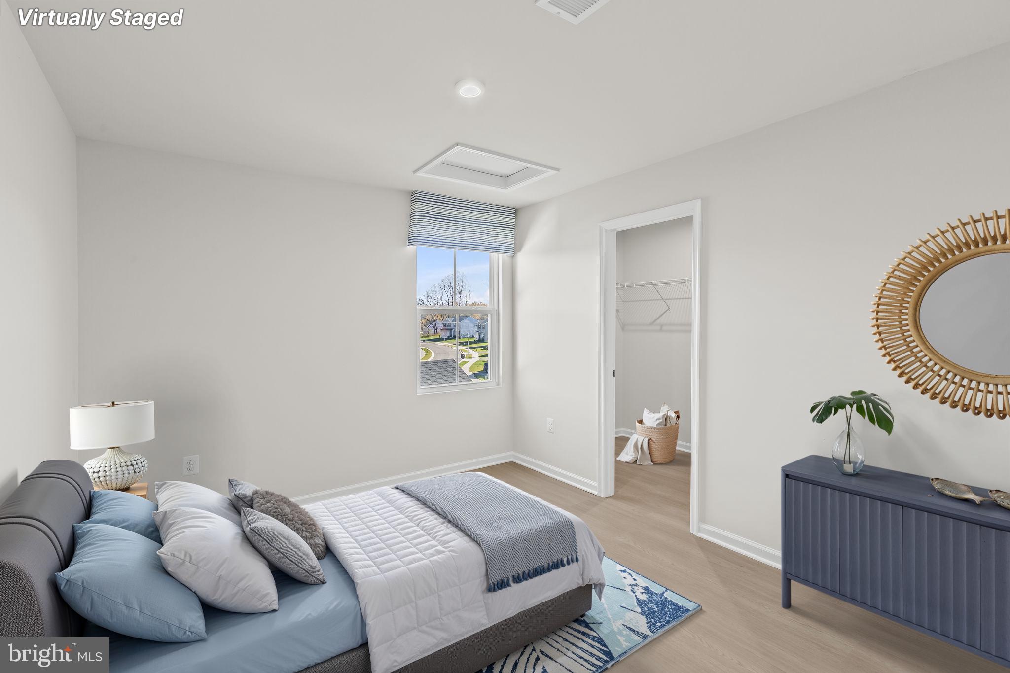 5404 Vergo Road Capitol Heights, MD 20743 - Photo 19 of 36 a bedroom with bed and wooden floor