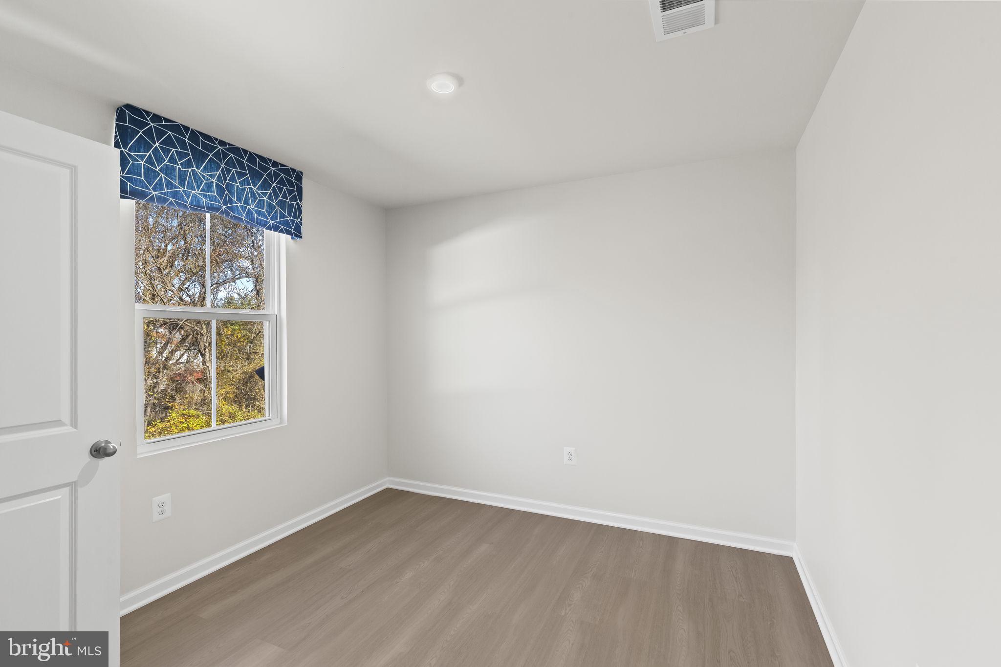5404 Vergo Road Capitol Heights, MD 20743 - Photo 24 of 36 an empty room with a window