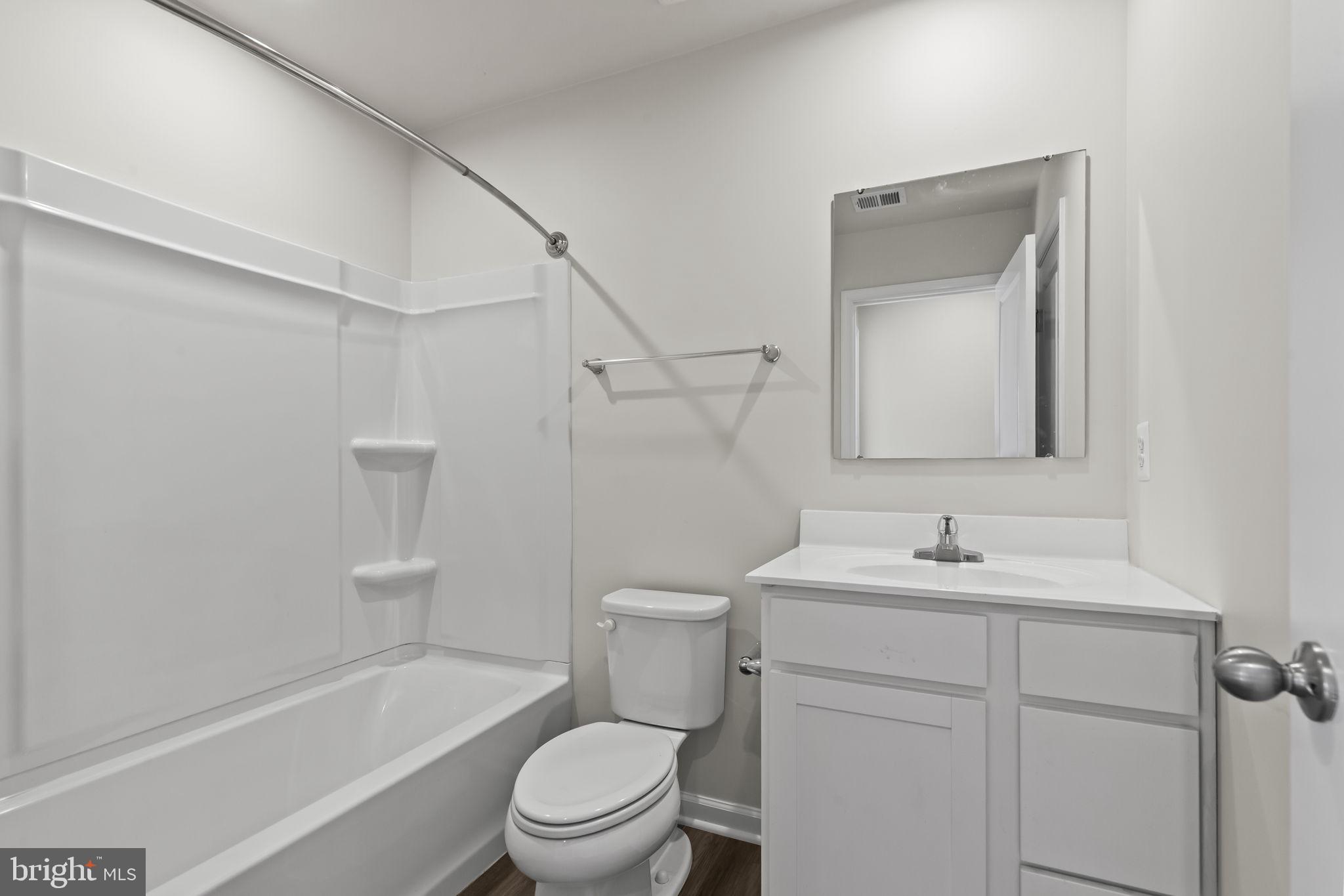 5404 Vergo Road Capitol Heights, MD 20743 - Photo 26 of 36 a bathroom with a toilet a sink and a bathtub