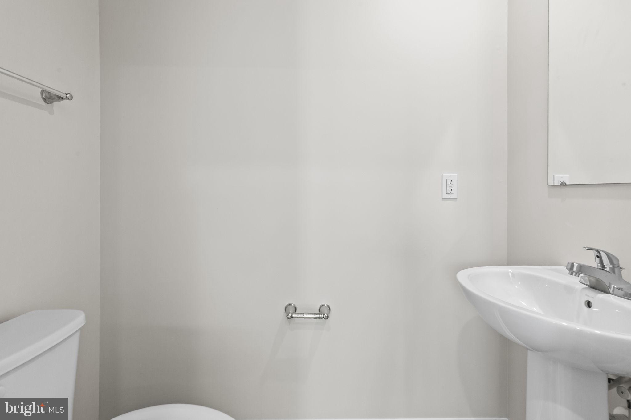 5404 Vergo Road Capitol Heights, MD 20743 - Photo 9 of 36 a bathroom with a sink a toilet