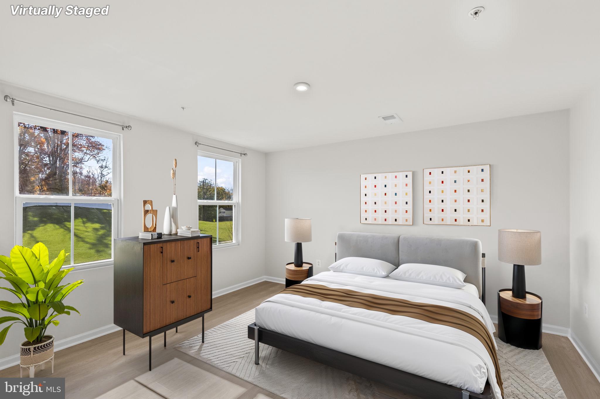 5404 Vergo Road Capitol Heights, MD 20743 - Photo 10 of 36 a bedroom with a bed and windows