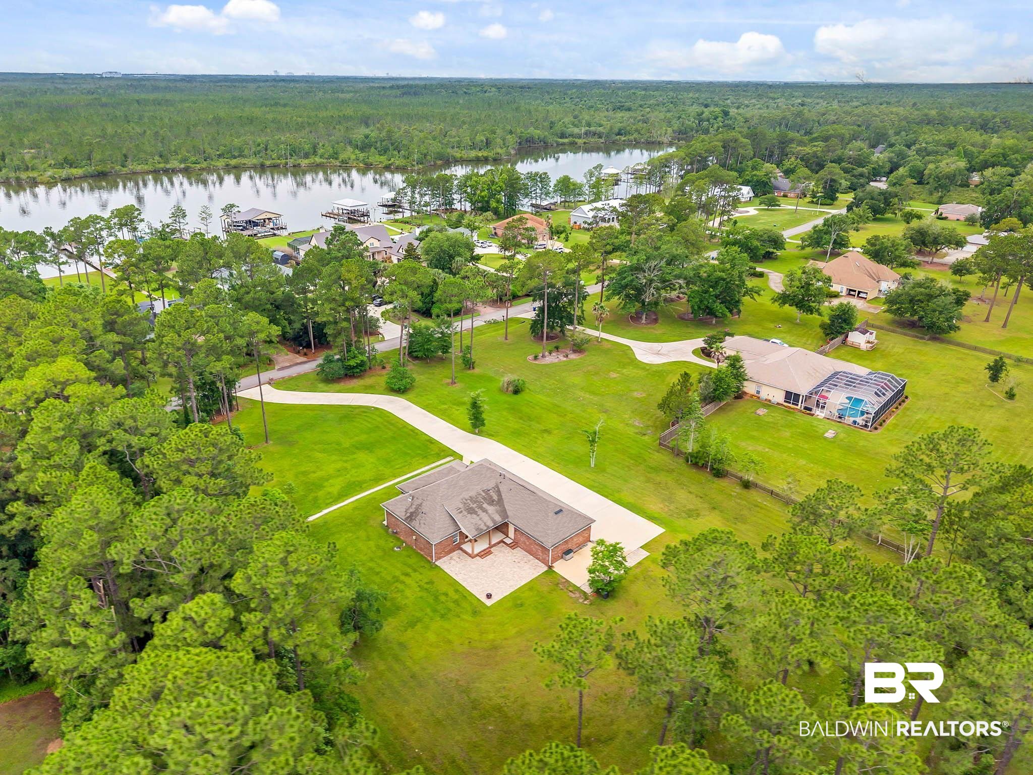8145 Bay View Drive Foley, AL 36535 - Photo 69 of 81 Aerial view of a nearby body of water and a heavily wooded area