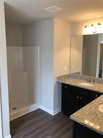a bathroom with a sink and mirror