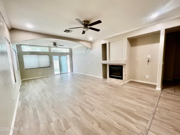 a view of livingroom with hardwood floor and ceiling fan