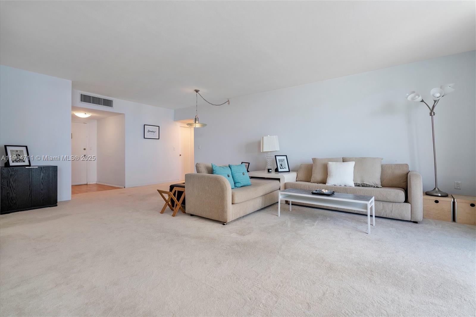 5001 Collins Avenue, Unit 11F Miami Beach, FL 33140 - Photo 14 of 43 a living room with furniture and a couch