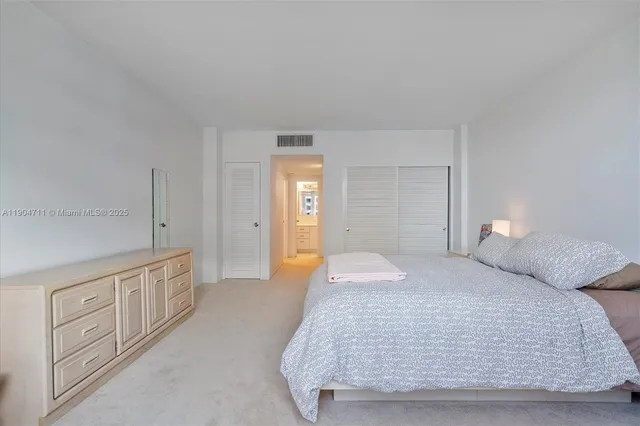 a bathroom with a sink a toilet and vanity