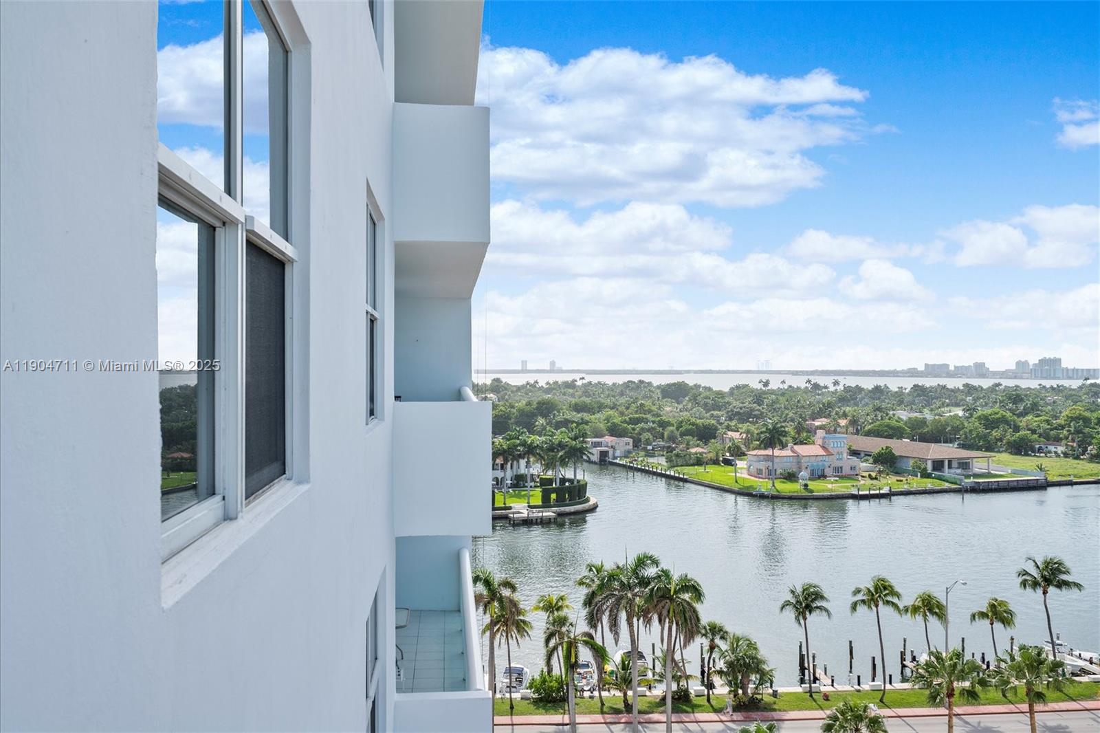 5001 Collins Avenue, Unit 11F Miami Beach, FL 33140 - Photo 25 of 43 a view of a lake from a balcony