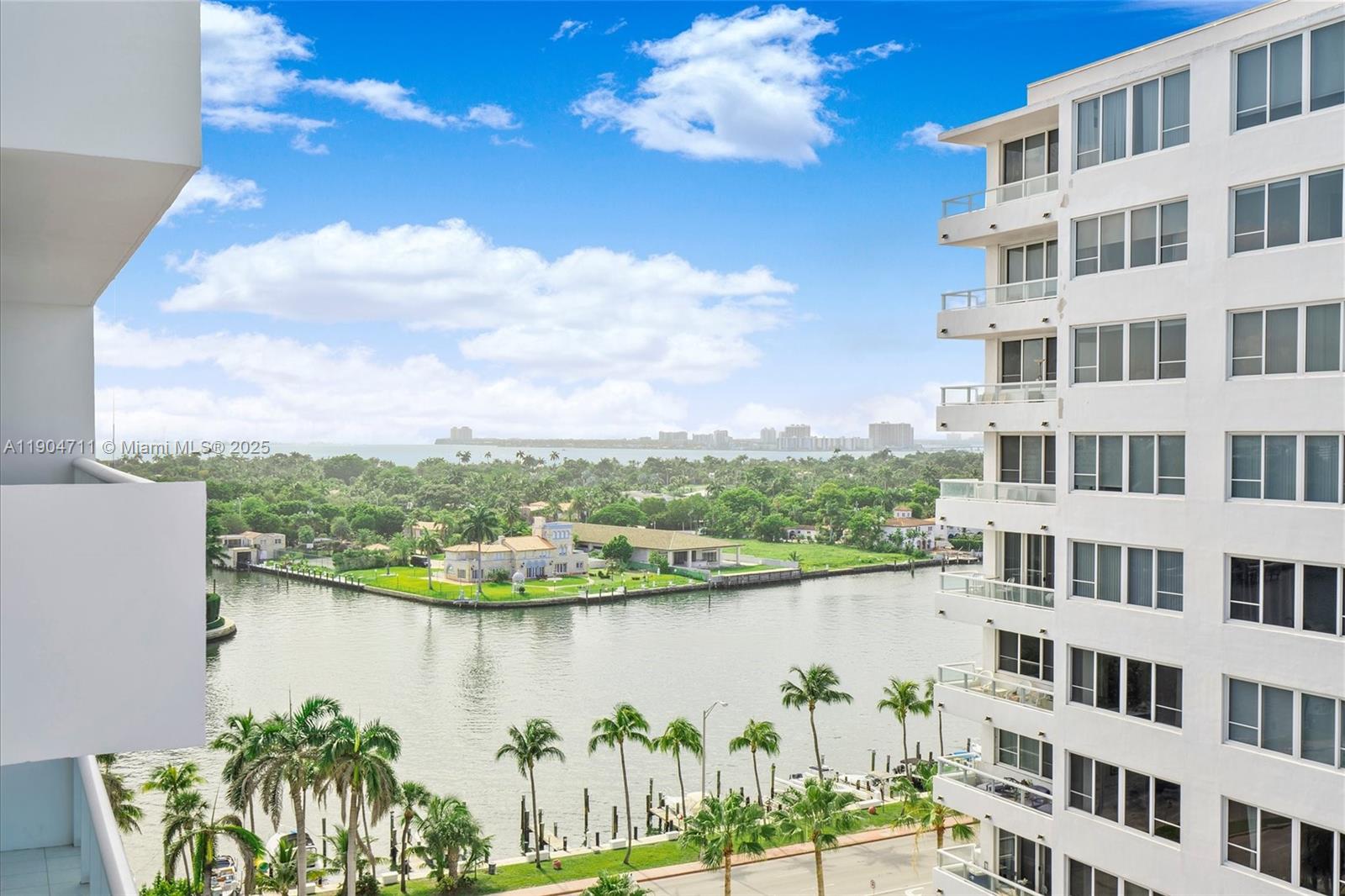 5001 Collins Avenue, Unit 11F Miami Beach, FL 33140 - Photo 27 of 43 a view of a lake with a building in front of it