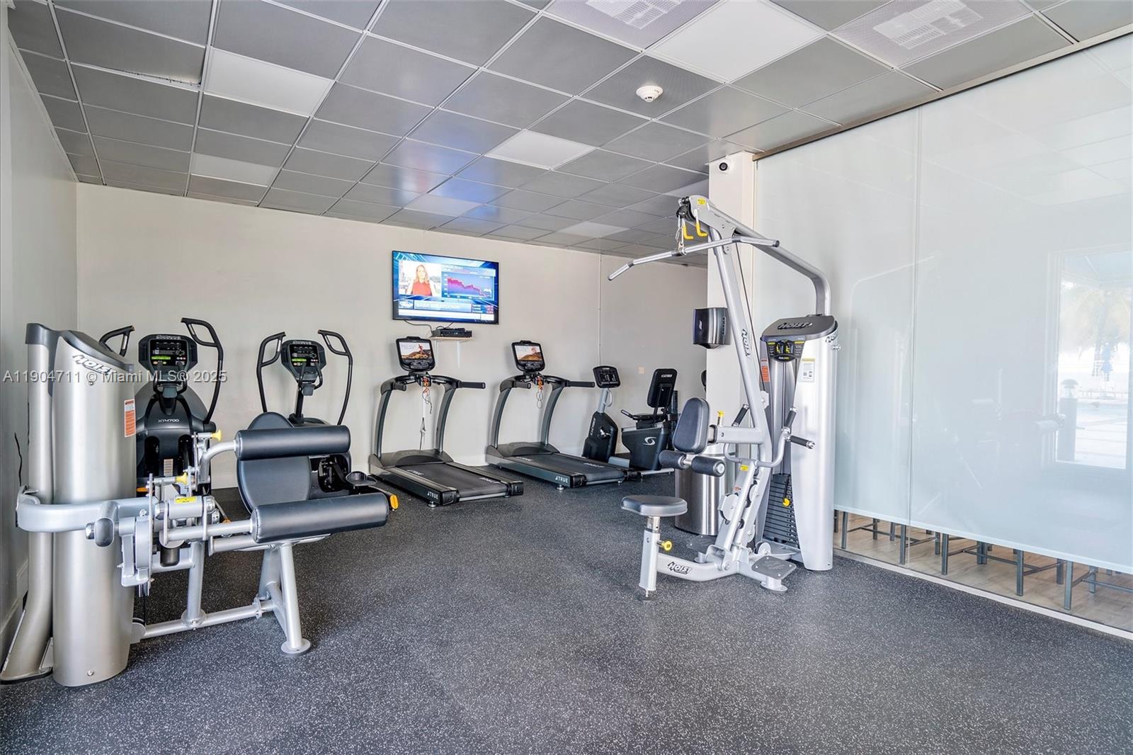 5001 Collins Avenue, Unit 11F Miami Beach, FL 33140 - Photo 29 of 43 a view of a room with gym equipment