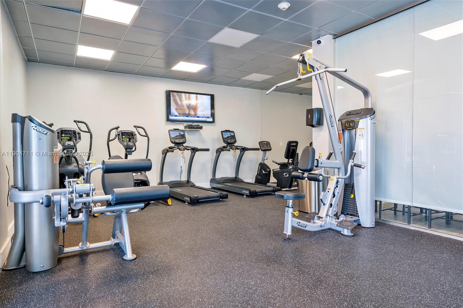 5001 Collins Avenue, Unit 11F Miami Beach, FL 33140 - Photo 30 of 43 a view of a room with gym equipment