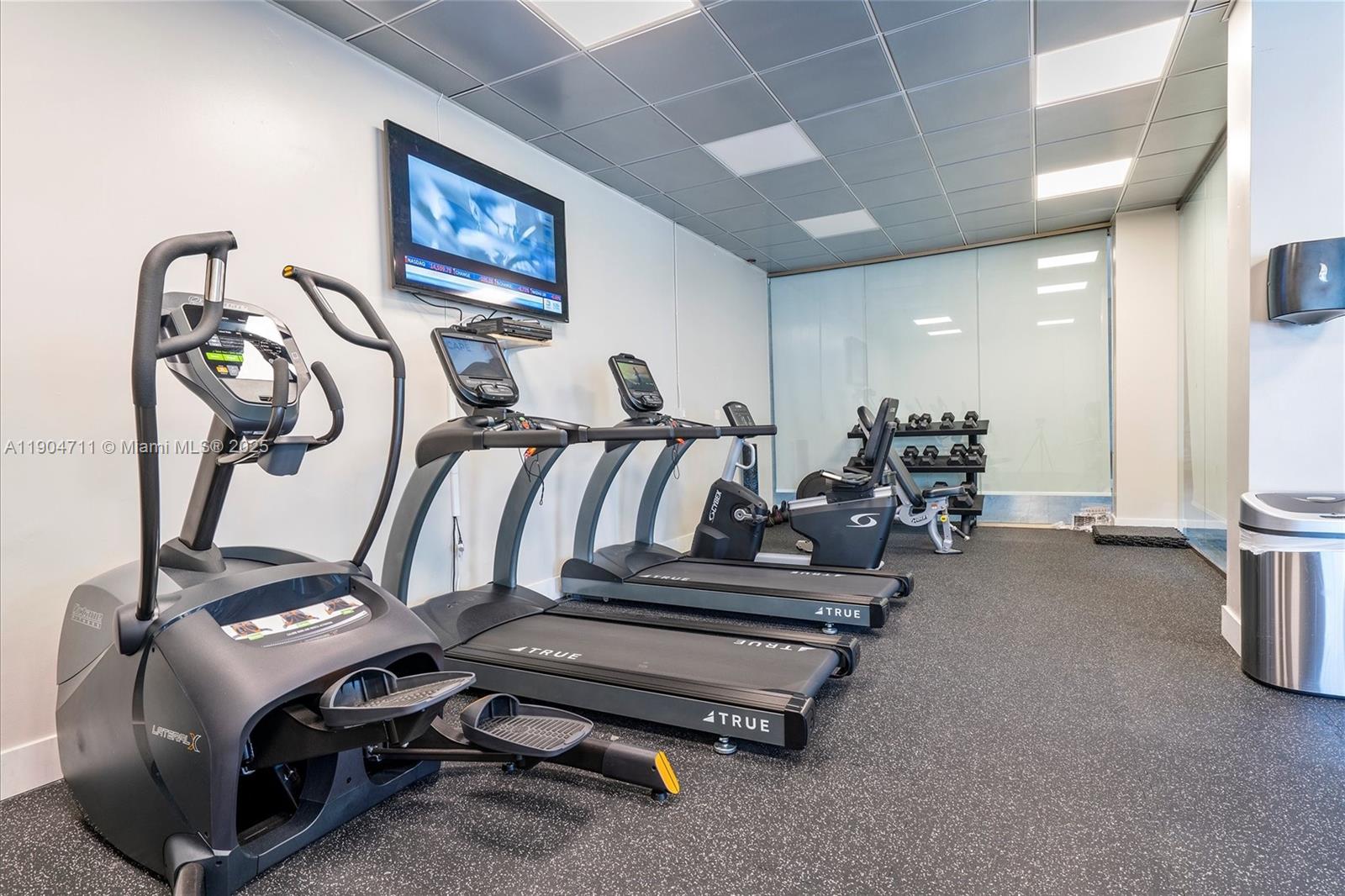 5001 Collins Avenue, Unit 11F Miami Beach, FL 33140 - Photo 31 of 43 a view of a room with gym equipment