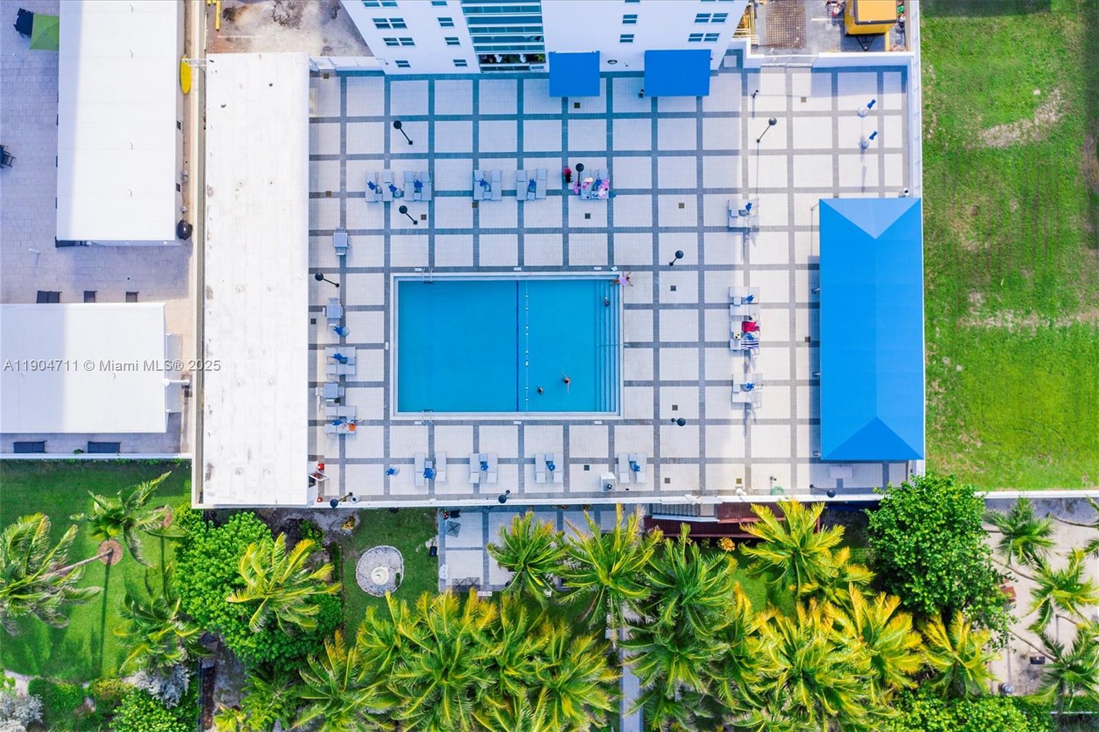 5001 Collins Avenue, Unit 11F Miami Beach, FL 33140 - Photo 37 of 43 a view of a garden with a building