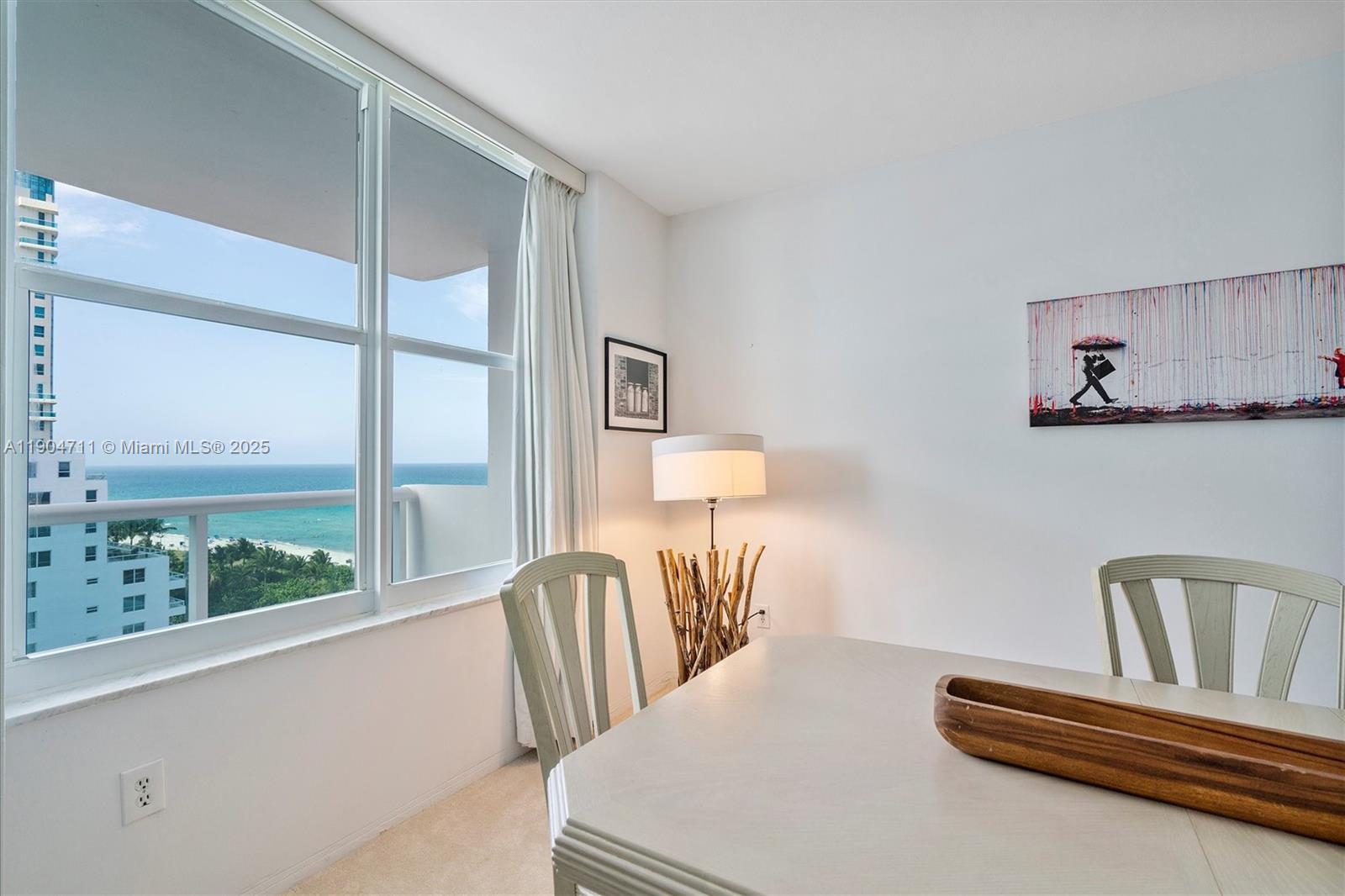 5001 Collins Avenue, Unit 11F Miami Beach, FL 33140 - Photo 8 of 43 a bedroom with a bed and a large window