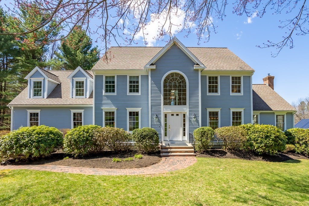 104 Nourse Road Bolton, MA 01740 - Photo 1 of 34 a front view of a house with a yard