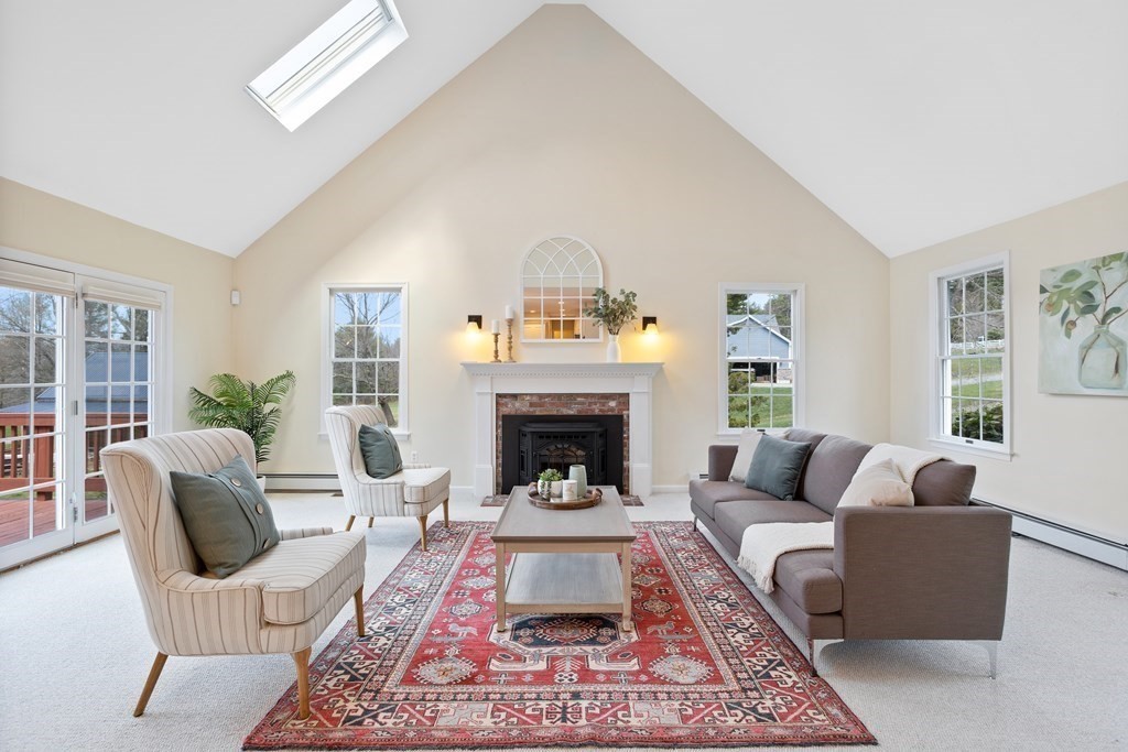 104 Nourse Road Bolton, MA 01740 - Photo 12 of 34 a living room with furniture and a fireplace