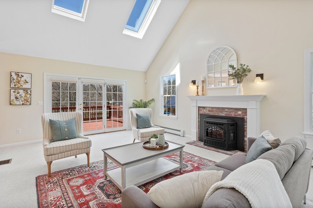 104 Nourse Road Bolton, MA 01740 - Photo 13 of 34 a living room with furniture and a fireplace
