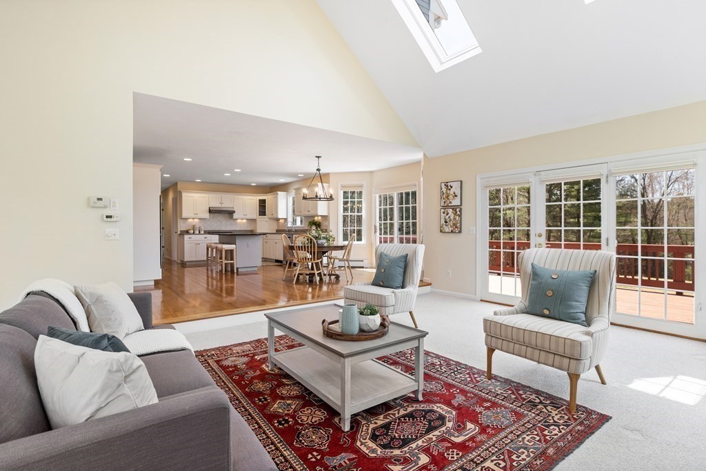 104 Nourse Road Bolton, MA 01740 - Photo 14 of 34 a living room with furniture and a rug