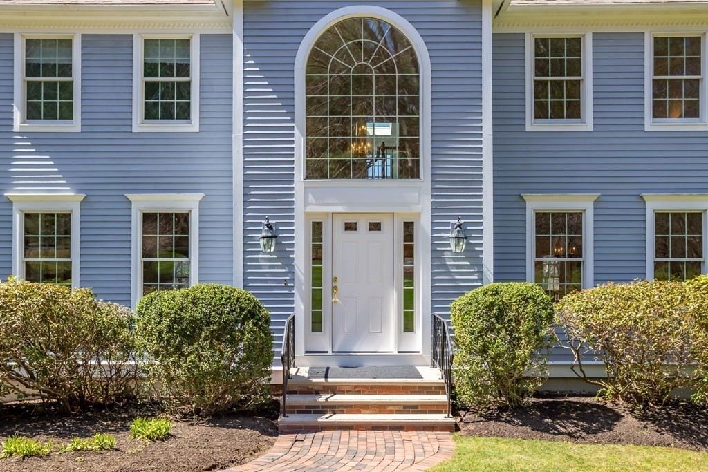 104 Nourse Road Bolton, MA 01740 - Photo 2 of 34 a front view of a house having yard