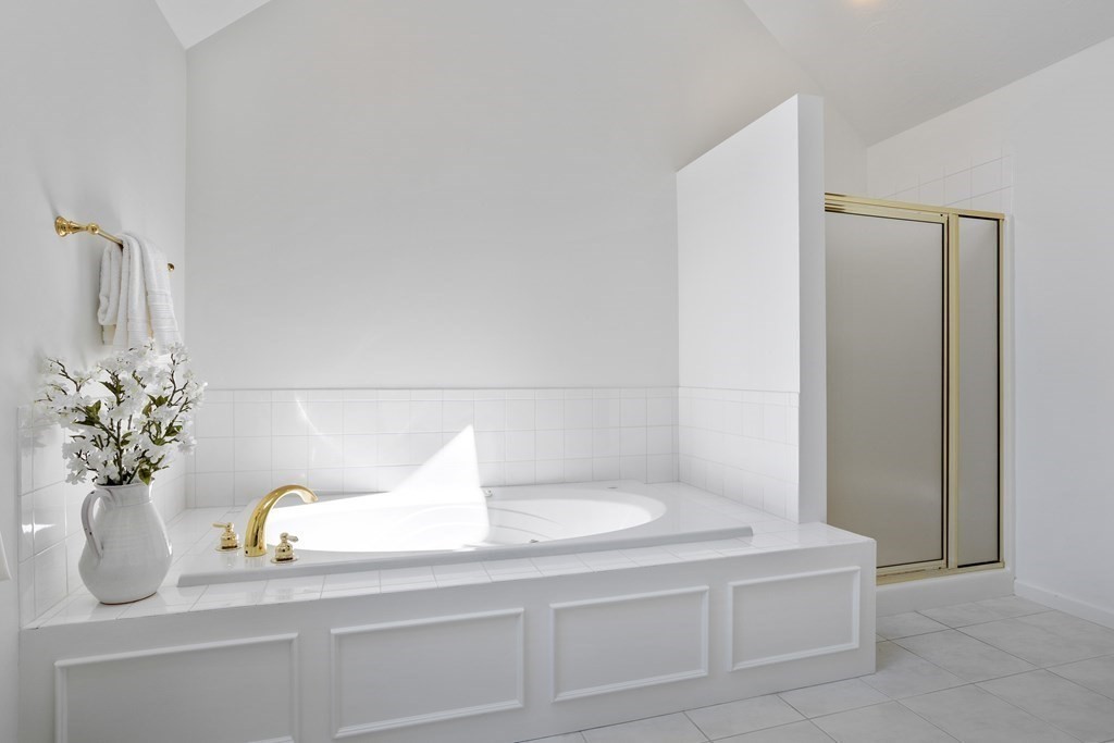 104 Nourse Road Bolton, MA 01740 - Photo 24 of 34 a bathroom with a sink a vanity and a mirror