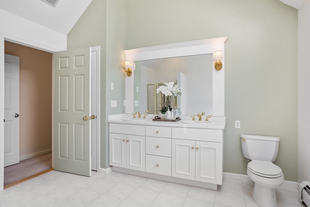 104 Nourse Road Bolton, MA 01740 - Photo 25 of 34 a bathroom with a granite countertop toilet sink and mirror
