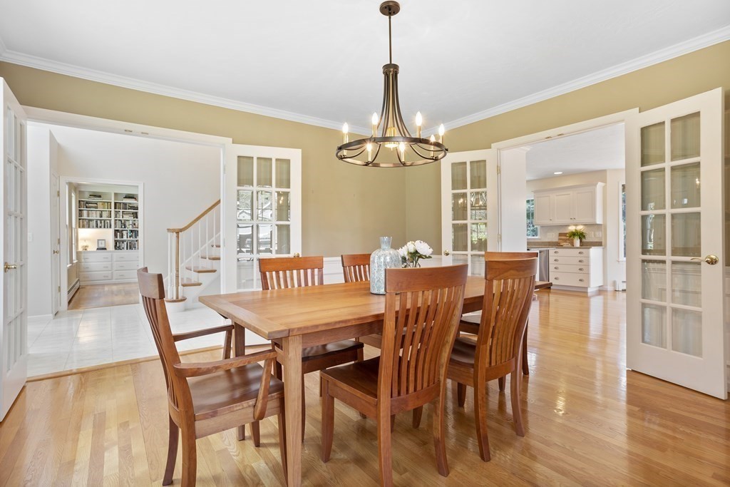 104 Nourse Road Bolton, MA 01740 - Photo 3 of 34 a view of a dining room with furniture wooden floor and chandelier