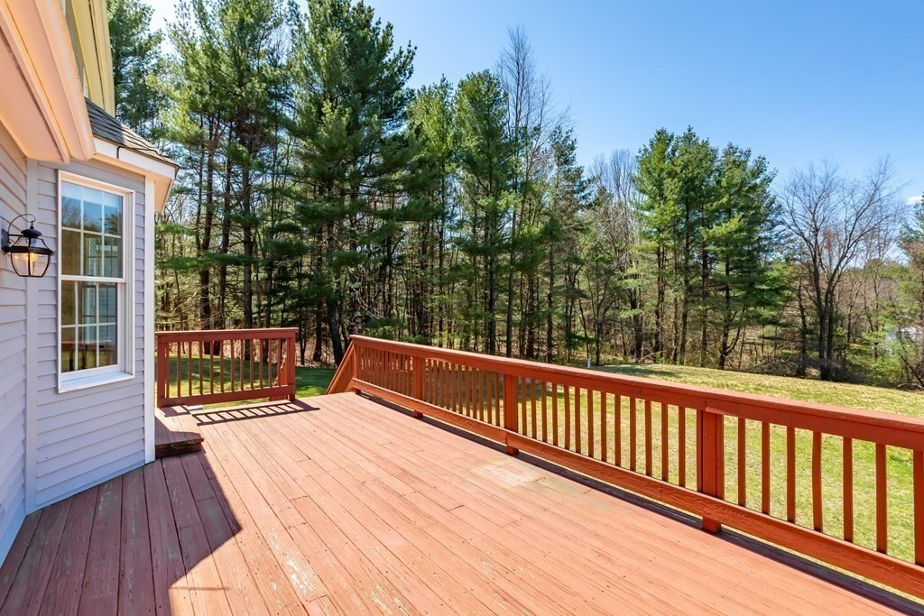 104 Nourse Road Bolton, MA 01740 - Photo 31 of 34 a view of balcony with wooden floor and fence