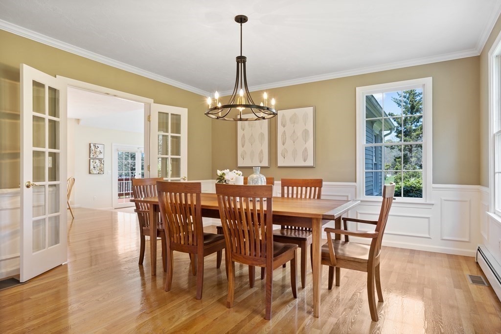 104 Nourse Road Bolton, MA 01740 - Photo 4 of 34 a view of a dining room with furniture window and wooden floor