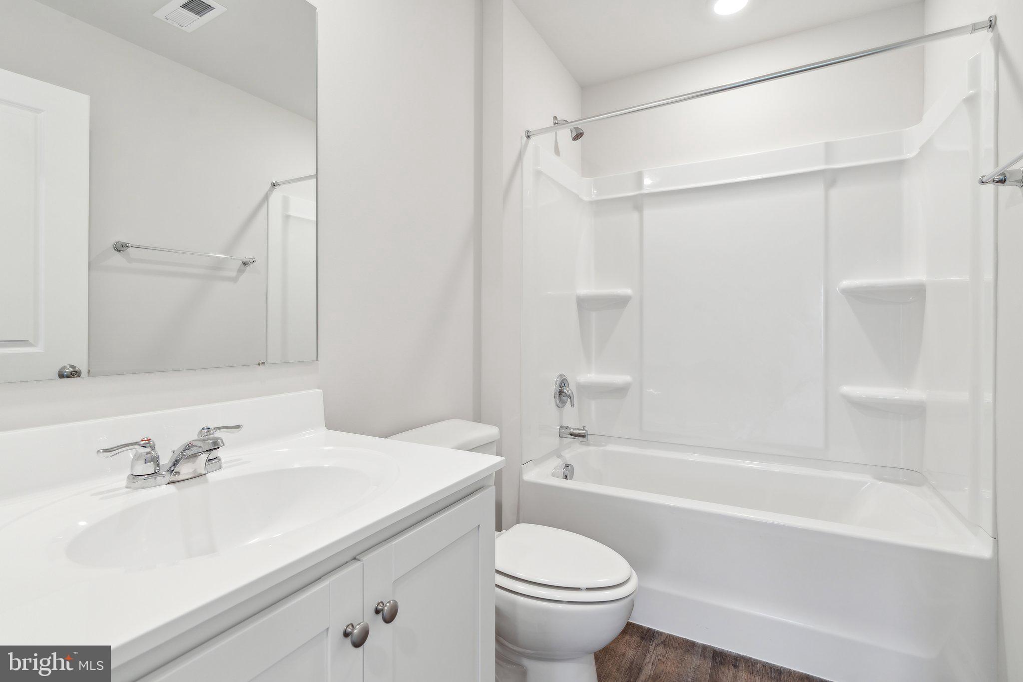 124 Parkland Road Greensboro, MD 21639 - Photo 16 of 20 a bathroom with a sink toilet and shower