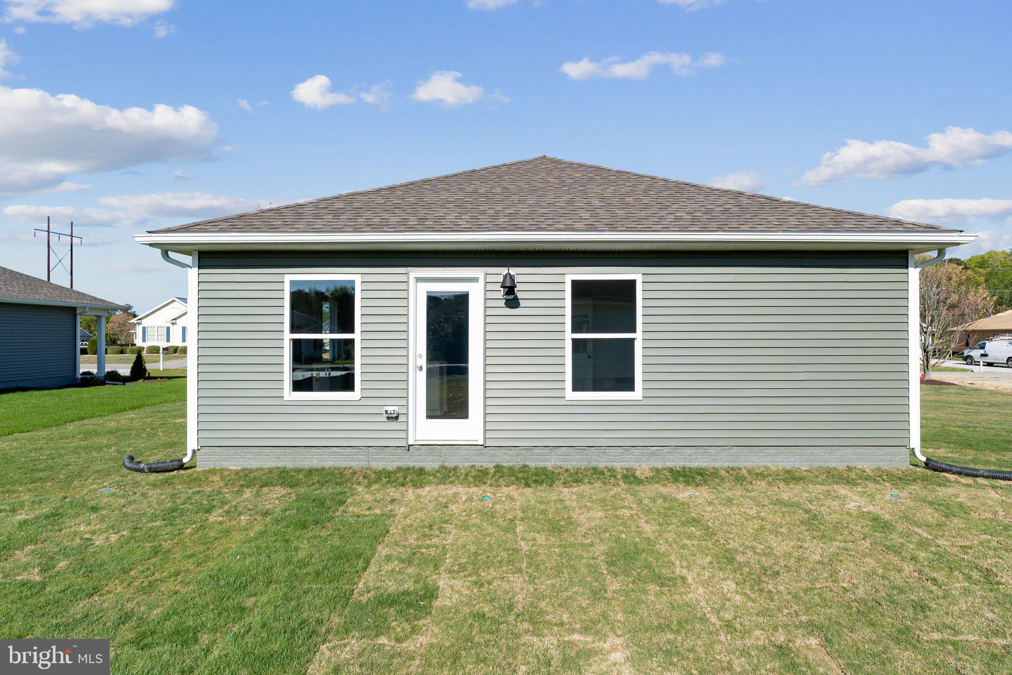 124 Parkland Road Greensboro, MD 21639 - Photo 20 of 20 a front view of a house with a yard