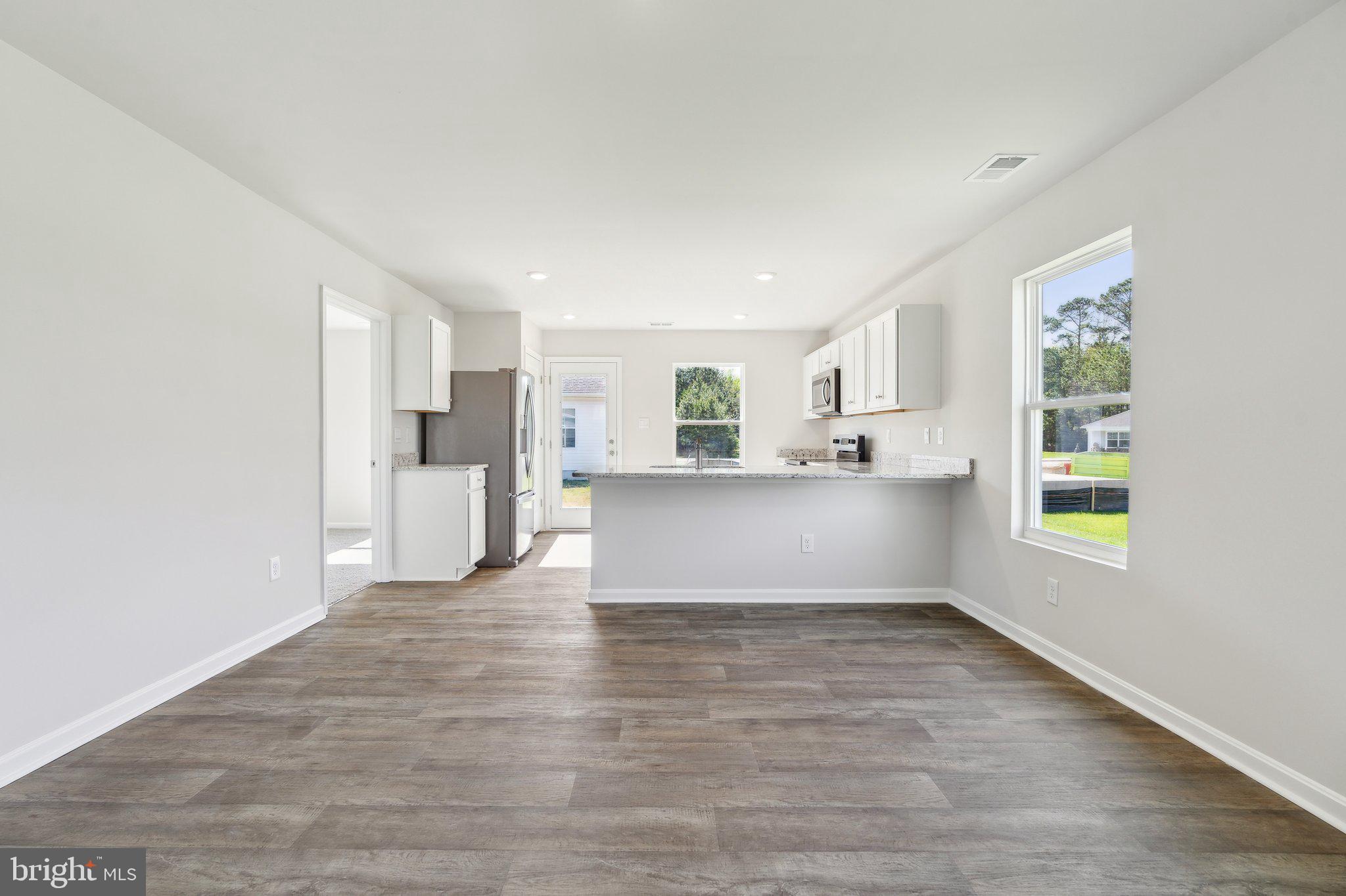 124 Parkland Road Greensboro, MD 21639 - Photo 3 of 20 a view of kitchen with wooden floor and electronic appliances