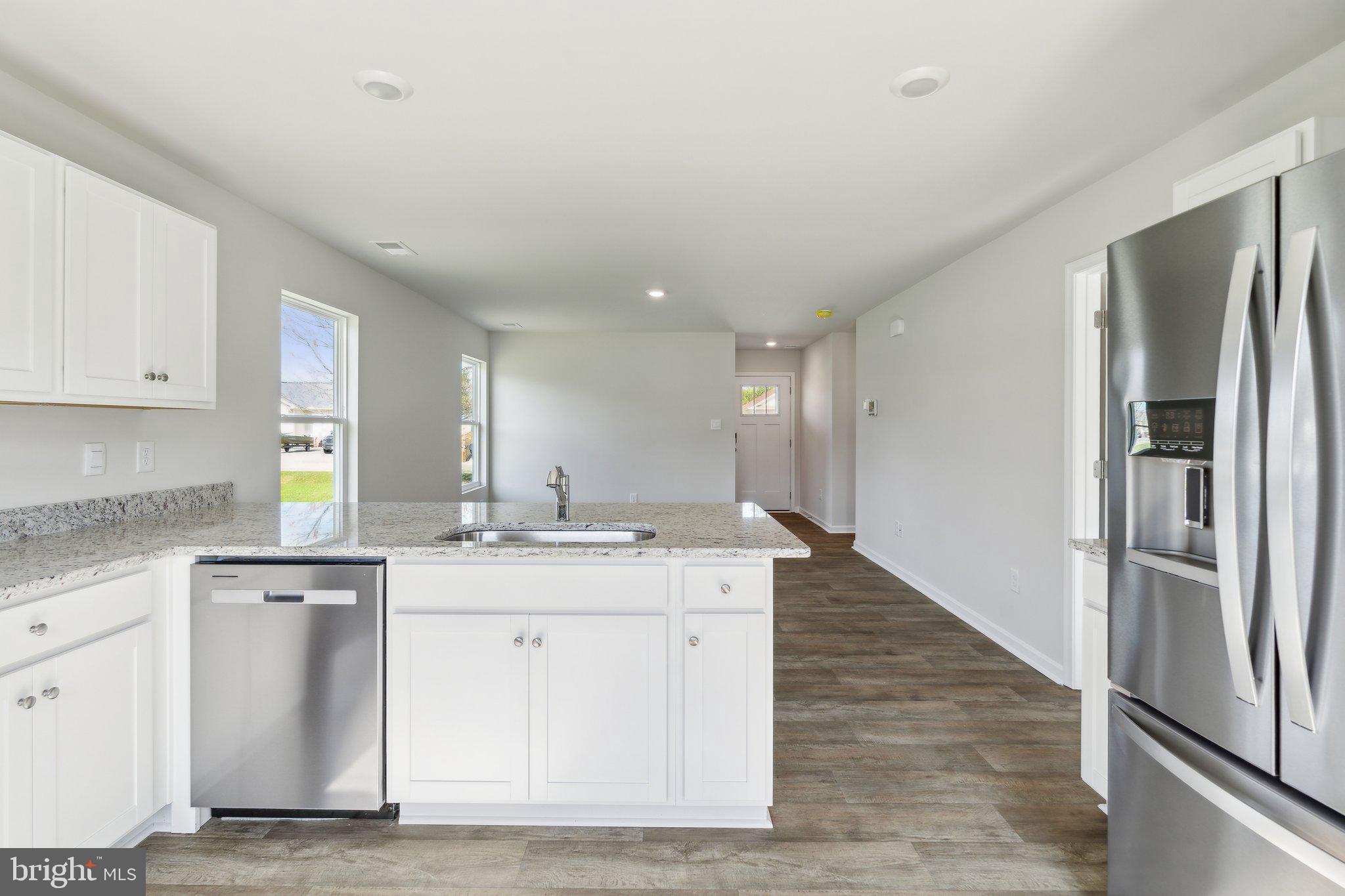124 Parkland Road Greensboro, MD 21639 - Photo 7 of 20 a kitchen with a sink stove and refrigerator