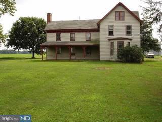 11815 Holly Road Ridgely, MD 21660 - Photo 1 of 5 a front view of a house with garden