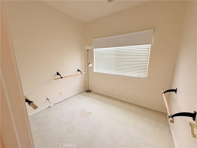 a view of a room that has a window in it