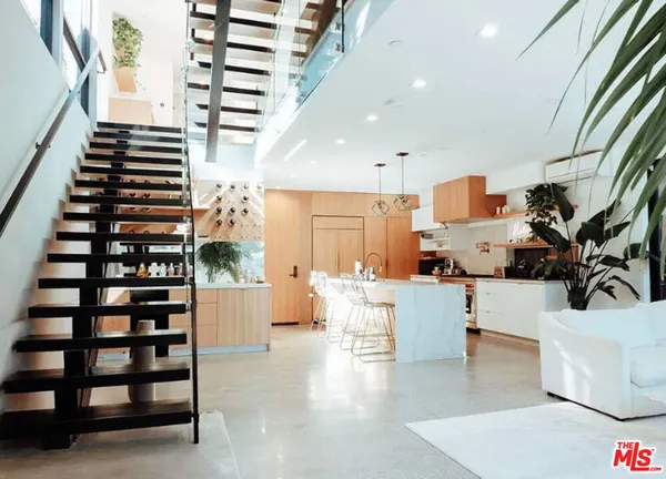 a kitchen with refrigerator and window