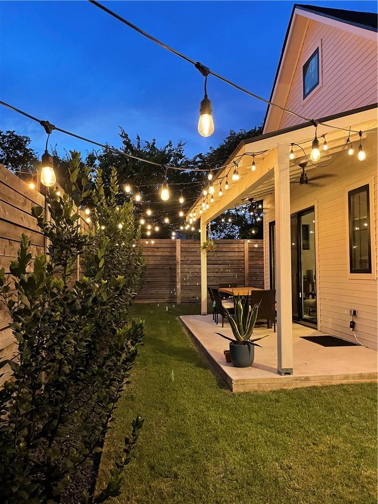 2002 East 9th Street, Unit 2 Austin, TX 78702 - Photo 25 of 32 Illuminated patio provides an inviting outdoor space for evening enjoyment.