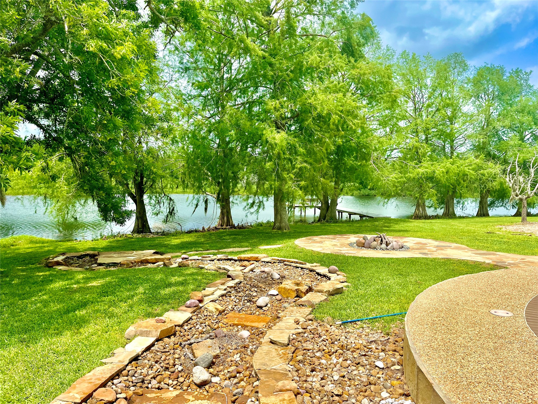 37243 FM 521 Road Bay City, TX 77414 - Photo 36 of 50 View of Cannon Lake from the pool terrace area. The lakeside mature cypress trees are absolutely amazing! The property line is a historic league line established by original Stephen F. Austin colonists prior to Texas independence from Mexico,