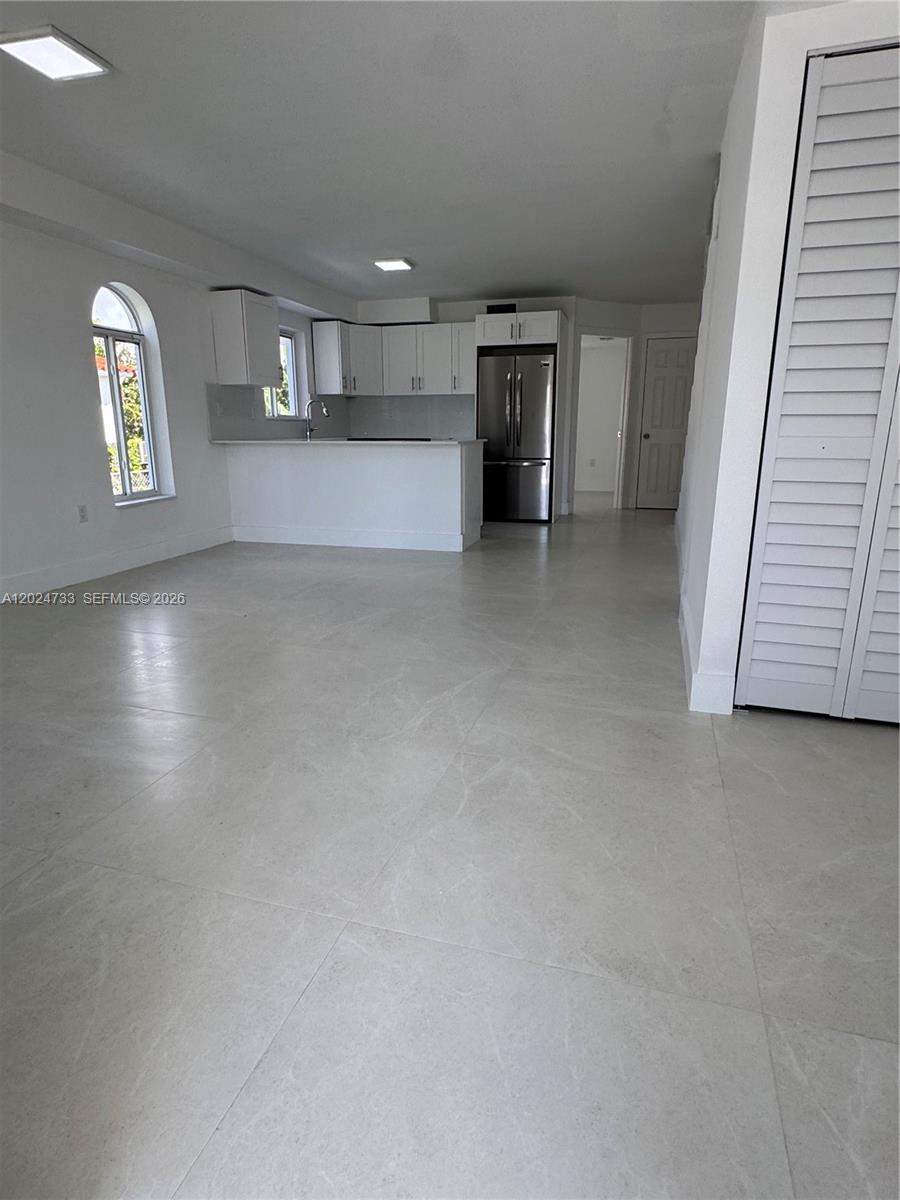 3305 Southwest 28th Street, Unit 3305 Miami, FL 33133 - Photo 3 of 17 an empty room with windows and closet