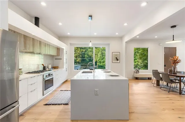 a view of living room with furniture and flat screen tv