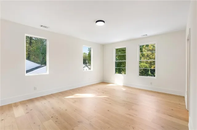 a bathroom with a toilet and shower