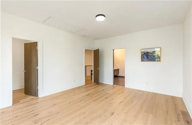 a bedroom with a bed and a mirror